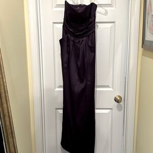 David’s Bridal strapless formal wear in plum with pockets.